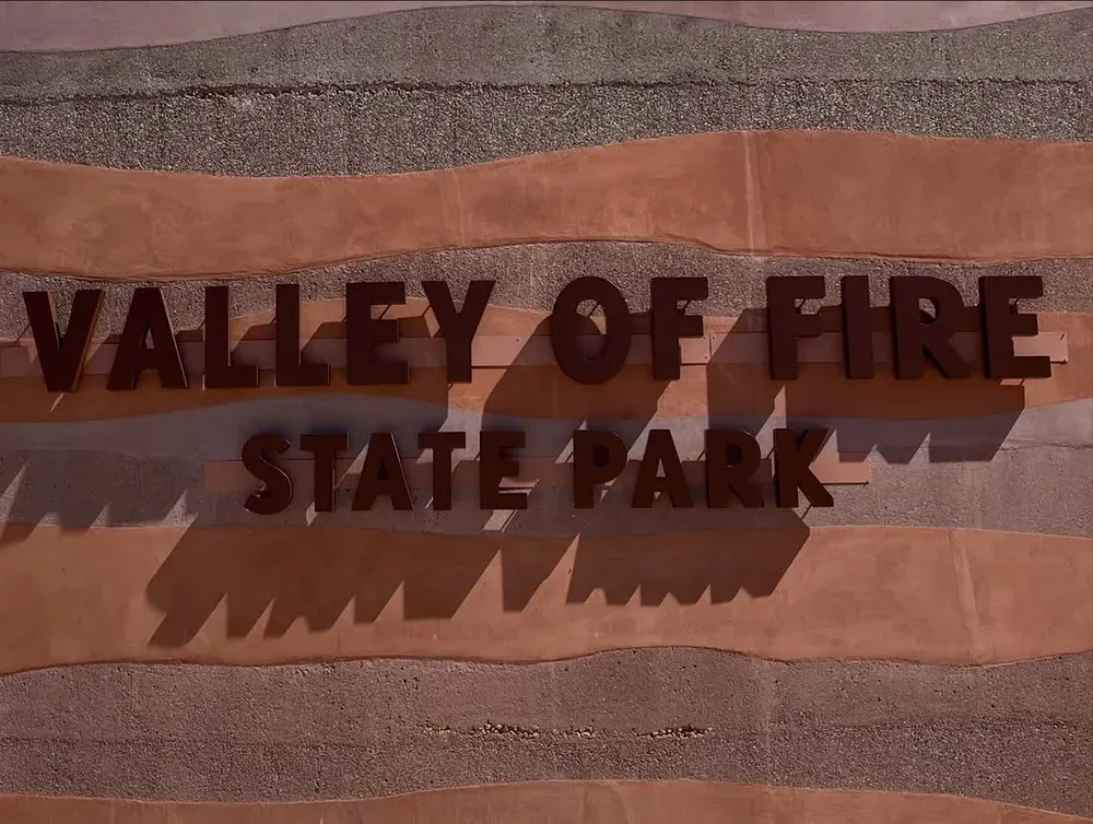 Valley of Fire State Park entrance sign carved into banded sandstone, Nevada