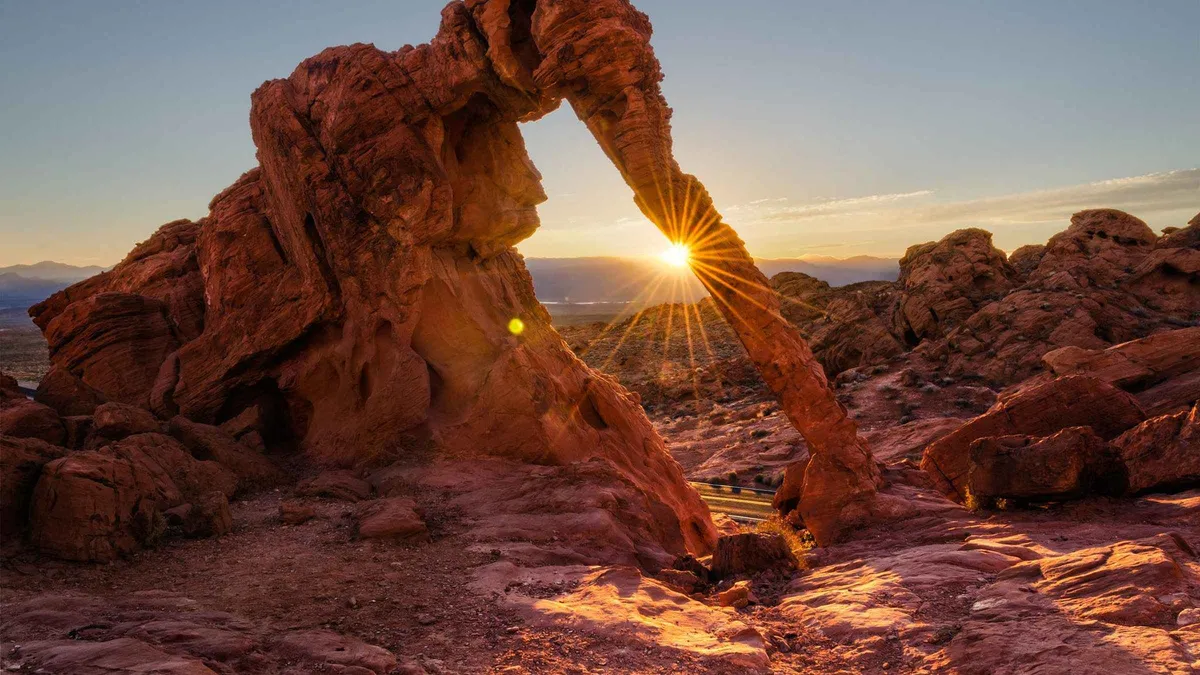 Towering red sandstone formations glowing in midday sun on a small-group Valley of Fire tour from Las Vegas, Nevada