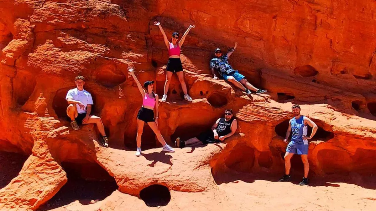 Picnic tables under sandstone at the Seven Sisters lunch stop on a full-day Valley of Fire tour from Las Vegas, Nevada