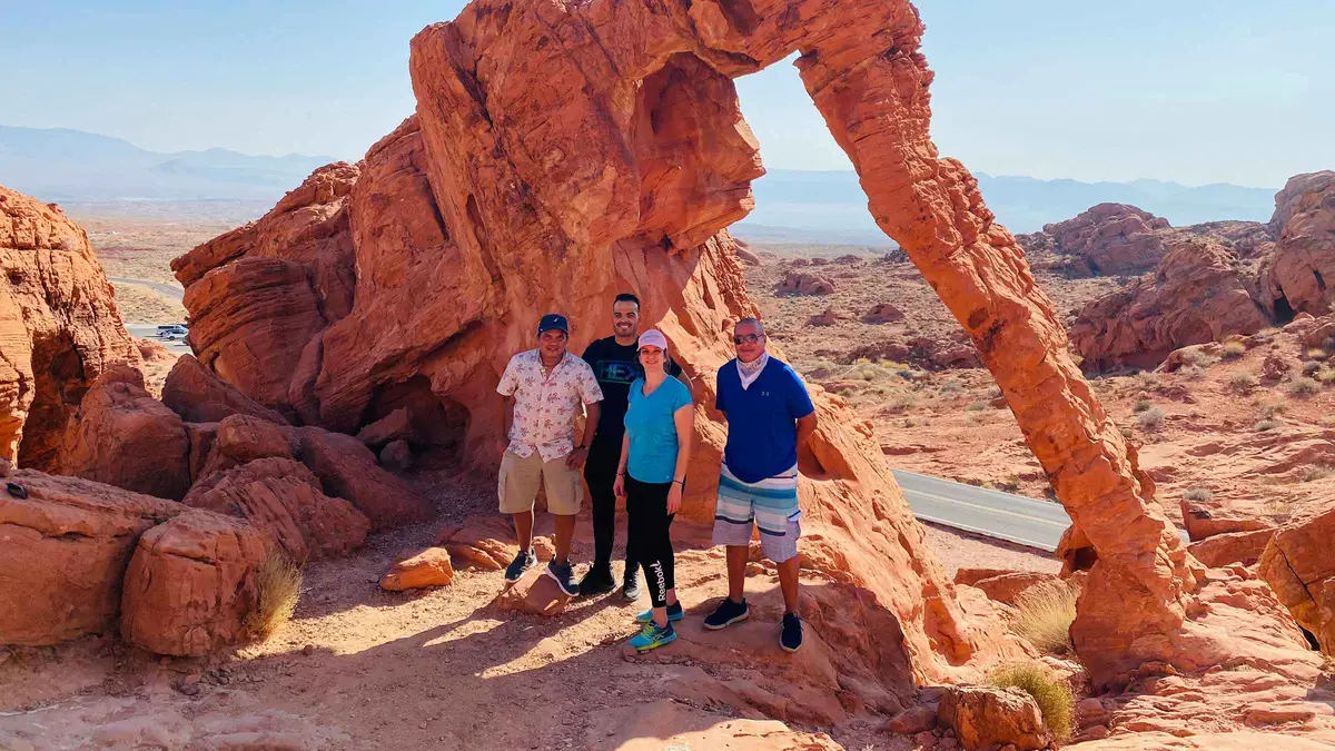 Small group photographing red sandstone formations on a half-day Valley of Fire tour from Las Vegas, Nevada