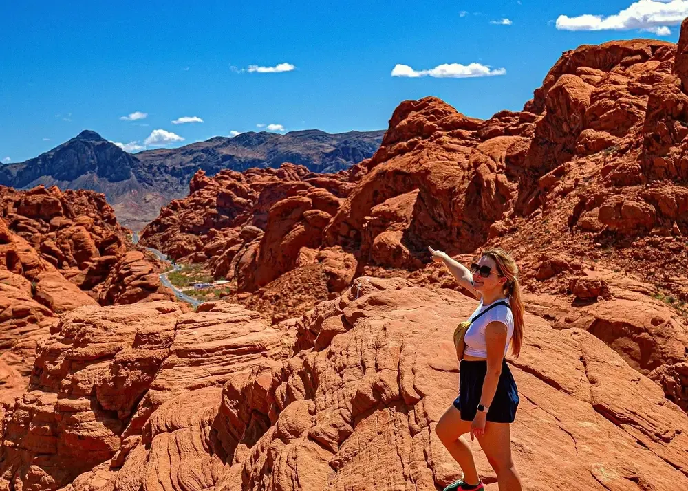 Wide view over red sandstone ridges and the park road from a high point in Valley of Fire, Nevada